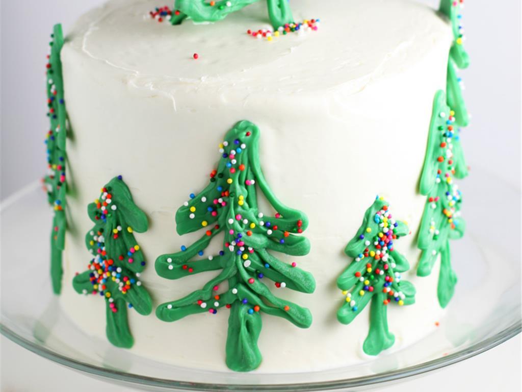 Smooth The Sides With An Offset Icing Spatula Gently Add Chilled Candy Christmas Trees To Side Of Cake And On Top If Desired Smooth The Sides With An Offset Icing Spatula Gently Add Chilled Candy Christmas Trees To Side Of Cake And On Top If Desired